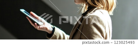 Smartphone usage young woman urban setting technology focus modern environment side view digital communication insight 123025493