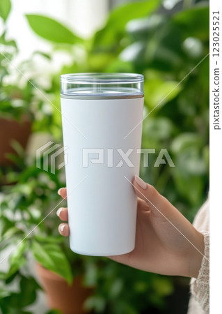 Hydration concept refreshing drink in a bright indoor plant lifestyle setting 123025521