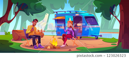 People enjoy outdoor recreation near motorhome 123026323