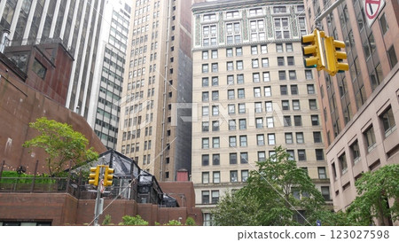 New York City street crossroad, yellow traffic light, transport road intersection, United States. 123027598