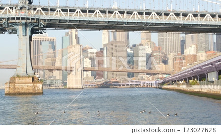 New York City Manhattan Bridge to Brooklyn. Waterfront downtown skyline cityscape, river Pier 35. New York City Manhattan Bridge to Brooklyn. Waterfront downtown skyline cityscape, river Pier 35. 123027628