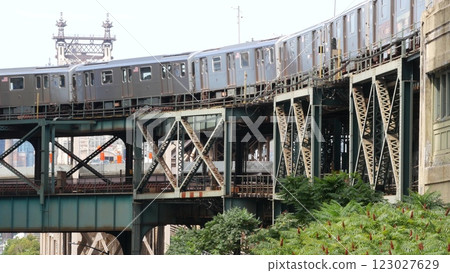 New York City elevated subway, metropolitan bridge, metro train track above street. Railway transport New York City elevated subway, metropolitan bridge, metro train track above street. Railway transport 123027629