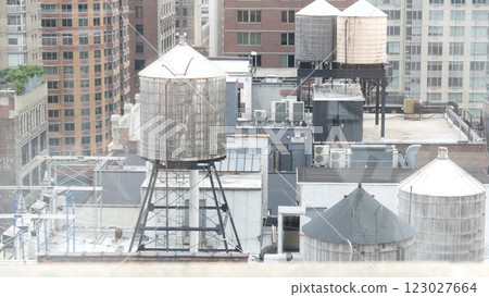 New York City Manhattan cityscape. Rooftop water towers, residential district buildings roof tanks. 123027664