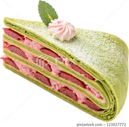 Tempting Layered Cake Slice with Creamy Frosting and Mint Garnish 123027772