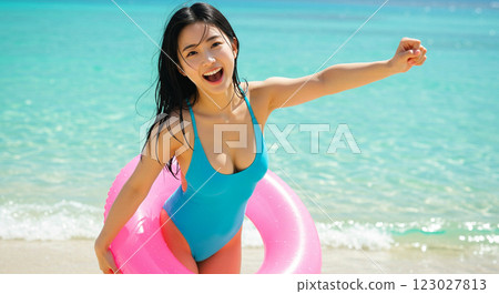 Young woman in bikini with swim ring 123027813