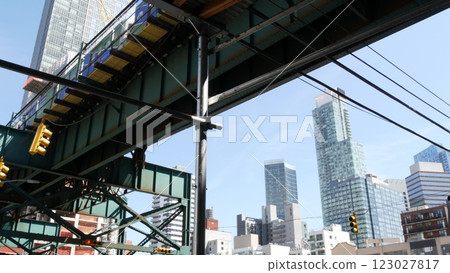 New York City elevated subway, metropolitan bridge, metro train track above street. Railway transport 123027817