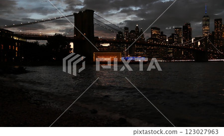 Brooklyn Bridge, Dumbo carousel. New York City Manhattan downtown skyline. Dramatic twilight dusk. 123027963
