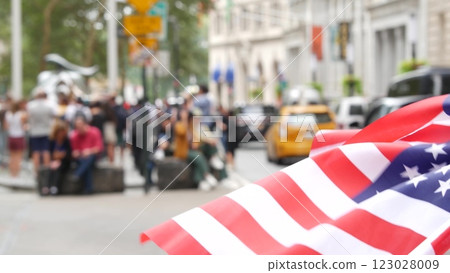 New York City Wall street Charging Bull. Manhattan Downtown Financial District, USA Flag on Broadway 123028009