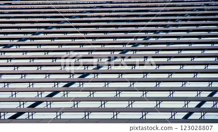 A striking pattern of horizontal lines and reflections. The repetitive structure creates a dynamic, modern aesthetic. 123028807