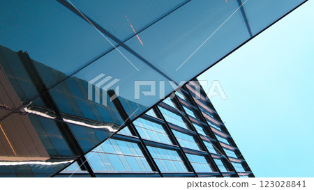 Blue Glass Facade with Reflection. Contemporary Cityscape 123028841