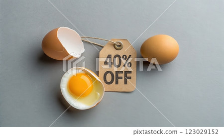 Cracked Egg with 40 Off Price Tag on Minimalist Gray Background 123029152