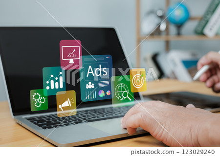 Online advertising concept Internet advertising digital marketing social media, Ad, Market, Product ads, Businessman using laptop with Ads dashboard digital marketing strategy analysis for branding. 123029240