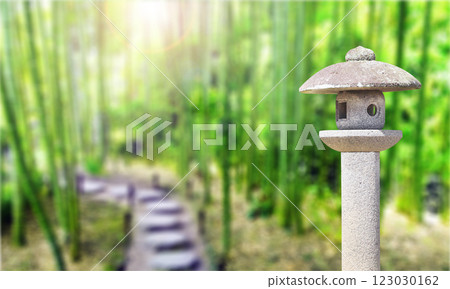 Stone lantern and footpath in bamboo garden, Japan, Asia. Picturesque landscape with bamboo forest and ancient stone lantern. Topic of vacation, travel, trip abroad on vacation, cruises and tours 123030162