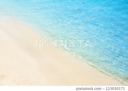 Sea waves on the sand beach. Starfish on the sand of an ocean coast. Tropical resort. Summer time concept. Topic of relaxing on the beach, vacation, travel, trip abroad on vacation, cruises and tours Sea waves on the sand beach. Starfish on the sand of an ocean coast. Tropical resort. Summer time concept. Topic of relaxing on the beach, vacation, travel, trip abroad on vacation, cruises and tours 123030171