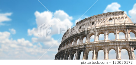 Horizontal banner with ancient Colosseum in Rome, Italy. Roman Colosseum on blue sky background. Topic of vacation, travel, trip abroad on vacation, cruises and tours Horizontal banner with ancient Colosseum in Rome, Italy. Roman Colosseum on blue sky background. Topic of vacation, travel, trip abroad on vacation, cruises and tours 123030172