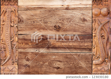 Horizontal background with wood carving frames with traditional moroccan wood carving with animals - crocodile, turtle. Ancient decorative carved border on wooden surface. Copy space for text Horizontal background with wood carving frames with traditional moroccan wood carving with animals - crocodile, turtle. Ancient decorative carved border on wooden surface. Copy space for text 123030180