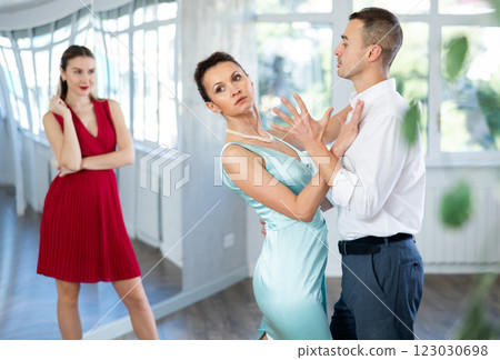 Female dance instructor showcasing tango moves with male student 123030698