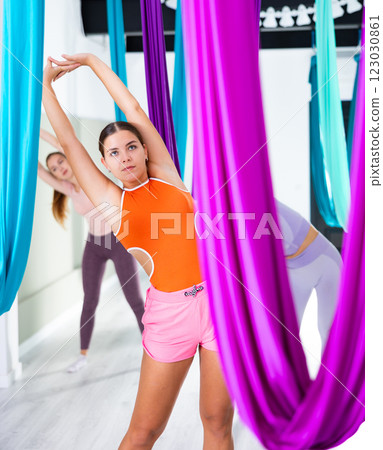 Warm up muscles before yoga class of women 123030861