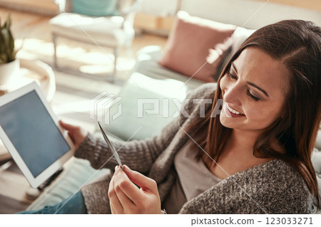 Tablet, credit card and woman on sofa online shopping in home living room. Fintech, ecommerce and happy female with technology buying products, banking payment or paying for goods on virtual store. 123033271