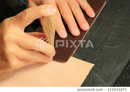 Making sewing holes with leather craft Making sewing holes with leather craft 123033871