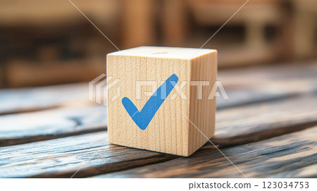 Wooden block with a blue check mark 123034753