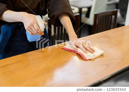A Japanese restaurant employee cleaning the restaurant A Japanese restaurant employee cleaning the restaurant 123035543