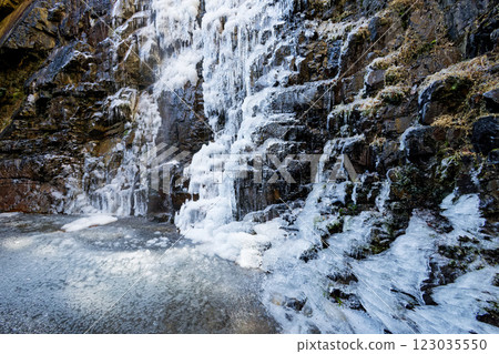 Frozen waterfall and waterfall basin seen from an angle Frozen waterfall and waterfall basin seen from an angle 123035550