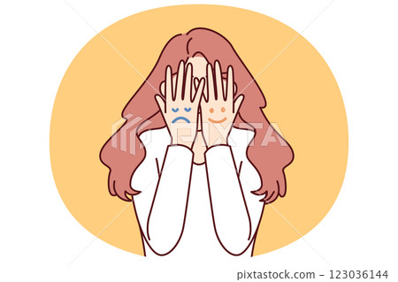 Faces with different moods are depicted on hands of woman hiding face for concept bipolar disorder Faces with different moods are depicted on hands of woman hiding face for concept bipolar disorder 123036144