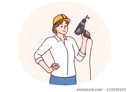 Woman with electric drill and hardhat for construction work or renovation premises 123036145