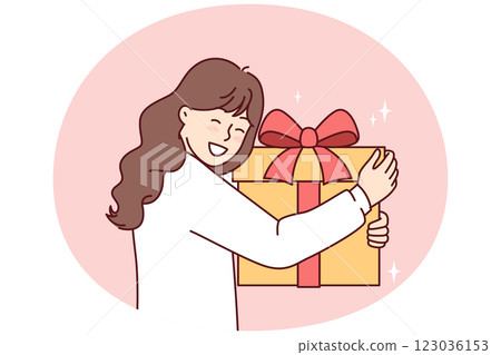 Teenage girl with big gift box with red ribbon smiling overjoyed at unexpected surprise 123036153