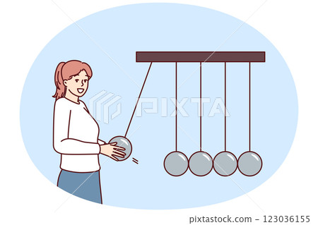 Businesswoman near Newton giant cradle symbolizing business management and employee motivation 123036155