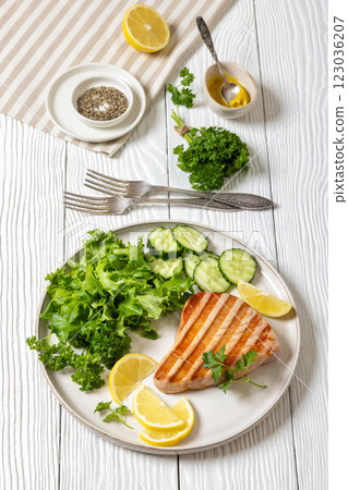 grilled tuna steak on a plate, top view grilled tuna steak on a plate, top view 123036207