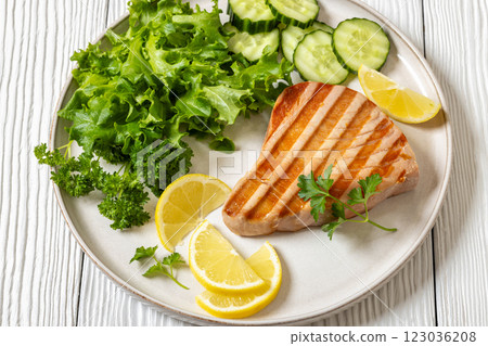 grilled tuna steak on a plate, top view grilled tuna steak on a plate, top view 123036208