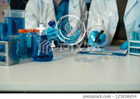 Science and medicine, scientist analyzing and dropping a sample into a glassware, experiments containing chemical liquid in laboratory on glassware, innovative and technology. 123036854