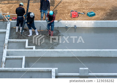 Housing image: Pouring concrete for the foundation work of an apartment building Housing image: Pouring concrete for the foundation work of an apartment building 123038282