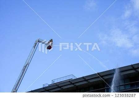 Water spraying from a ladder truck Water spraying from a ladder truck 123038287
