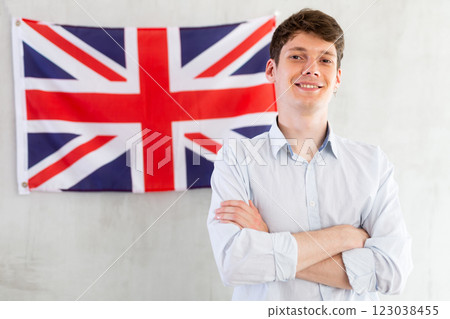 Young guy posing in front of UK flag Young guy posing in front of UK flag 123038455