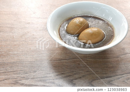 boiled egg stew in Chinese herb brown pork bone soup on bowl  123038983