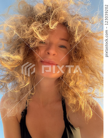 Young woman relaxing at the beach Young woman relaxing at the beach 123039202
