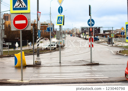 Pedestrian countdown timer showing five seconds remaining for safe crossing at a crosswalk Surrounded by various road signs. Ensuring pedestrian safety and traffic regulation in an urban environment. Pedestrian countdown timer showing five seconds remaining for safe crossing at a crosswalk Surrounded by various road signs. Ensuring pedestrian safety and traffic regulation in an urban environment. 123040798
