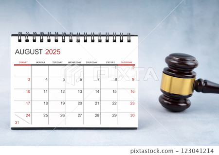 August 2025 desk calendar with judge's gavel. August 2025 desk calendar with judge's gavel. 123041214