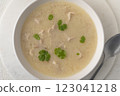 Georgian traditional chicken soup Chikhirtma in the white plate, flat lay  123041218