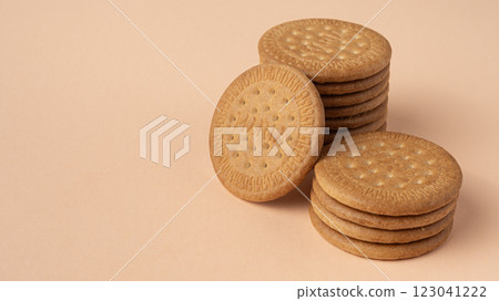 Marie biscuits on pink beige background. Marie biscuits on pink beige background. 123041222