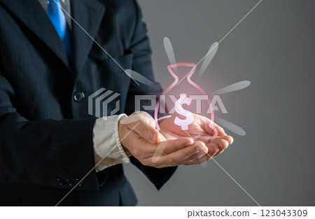 A businessman holds a symbol of a disappearing money bag. Financial loss, economic instability. Devaluation, inflation. Hidden expenses in business and investments. 123043309