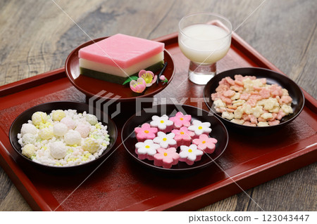 Hinamatsuri sweets such as hishi-mochi (rice cakes with diamond-shaped rice cakes), shirozake (rice wine with sake lees), and hina-arare (rice crackers) Hinamatsuri sweets such as hishi-mochi (rice cakes with diamond-shaped rice cakes), shirozake (rice wine with sake lees), and hina-arare (rice crackers) 123043447