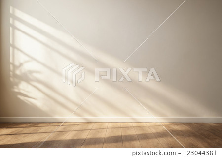 Minimalistic light background with blurred foliage shadow on white wall 123044381
