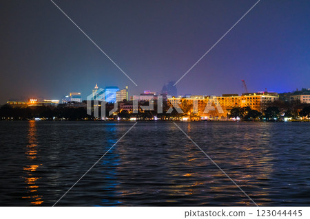 Hangzhou buildings and the world heritage site West Lake at night in Hangzhou, Zhejiang Province, China Hangzhou buildings and the world heritage site West Lake at night in Hangzhou, Zhejiang Province, China 123044445