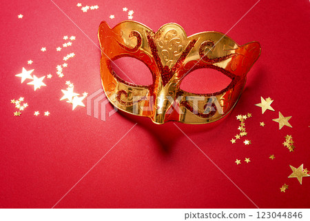 Carnival venetian mask with golden confetti Carnival venetian mask with golden confetti 123044846