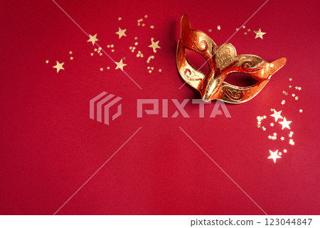 Carnival venetian mask with golden confetti 123044847