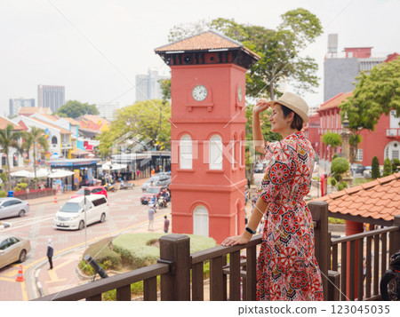 woman in dress and hat exploring vibrant streets of Malacca, Malaysia. woman in dress and hat exploring vibrant streets of Malacca, Malaysia. 123045035